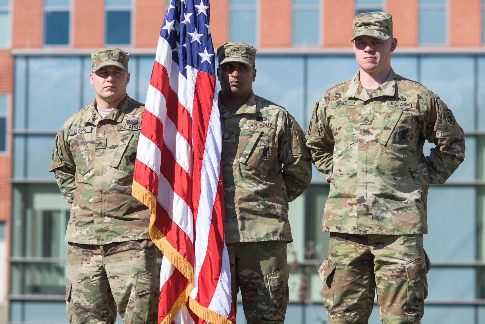 Soldiers standing with a flag