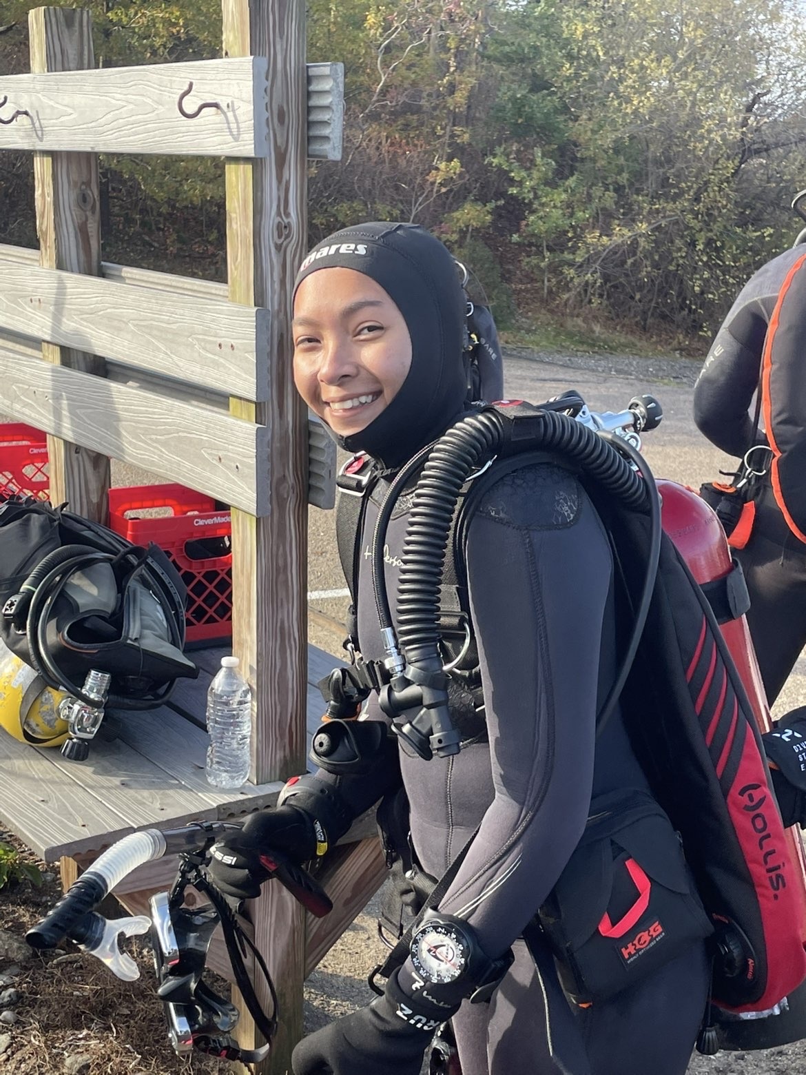Alina Tran in a scuba suit and oxygen gear